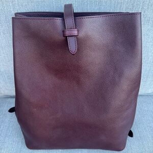 Lotuff handmade leather sling backpack